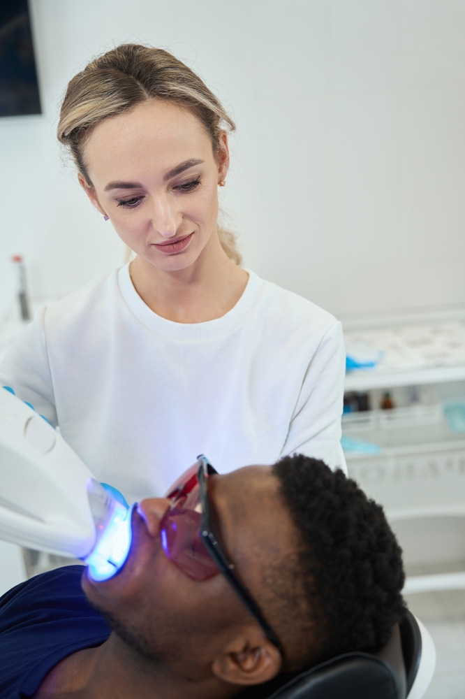 doctor-performing-teeth-whitening-procedure-on-mal-2024-10-22-12-01-53-utc (1)