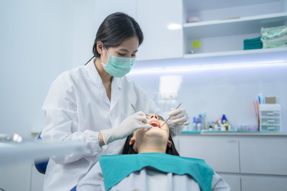 Dentist working with dental crowns in North York