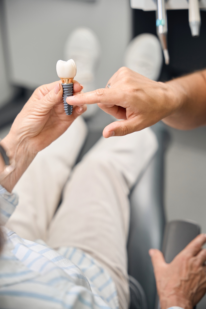 Dentist explaining dental implants in North York
